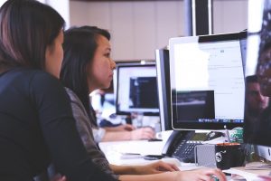 Two woman looking at omputer