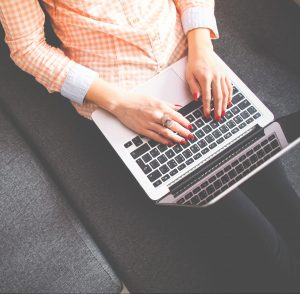 Photo of woman's hands on laptop