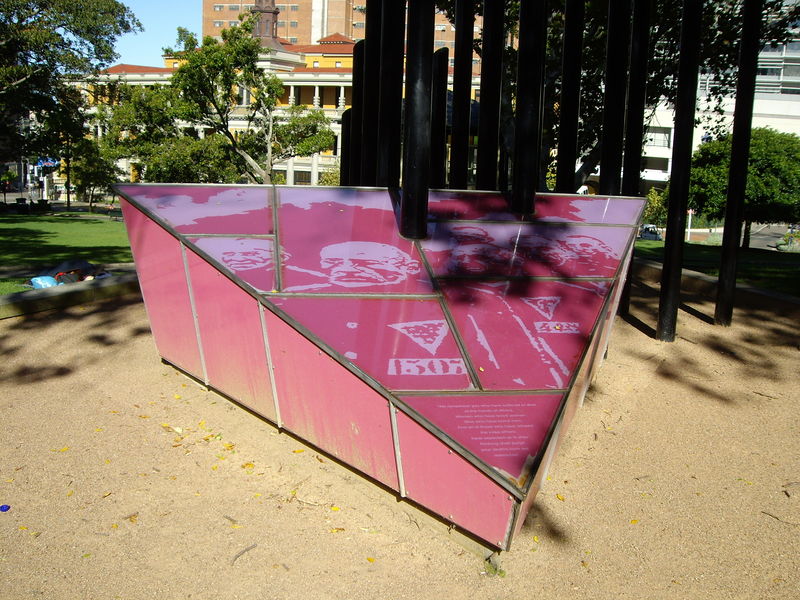 The Sydney Gay and Lesbian Holocaust Memorial, which is a large pink triangle with photos of people's faces.