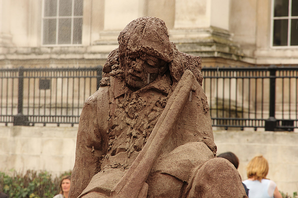 A statue of a soldier made from mud and sand