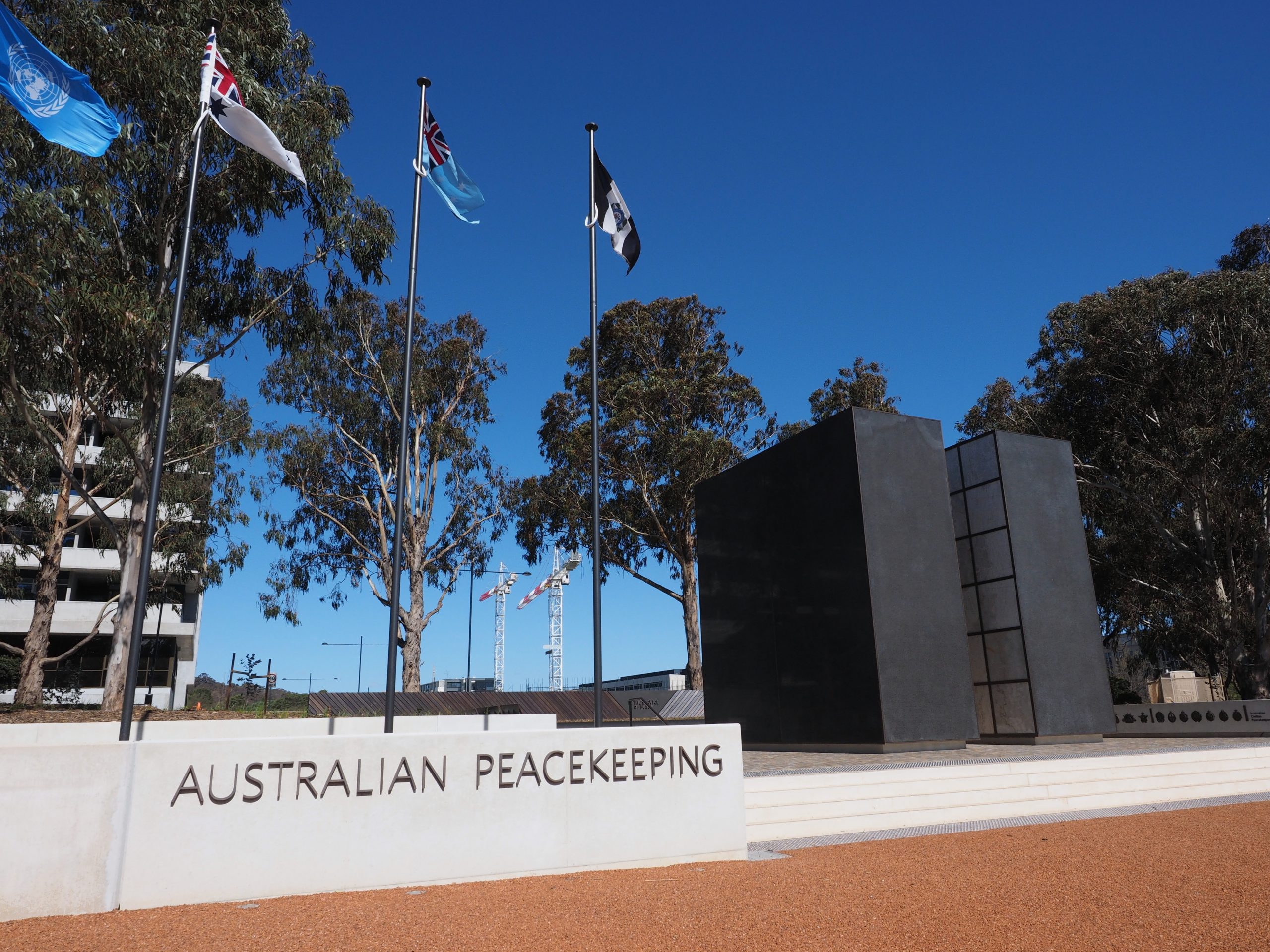 A general view of the Australian Peacekeeping Memorial, with flags rising from the ground.
