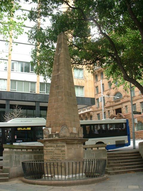 Photo of Macquarie Obelisk in the city with bus in background