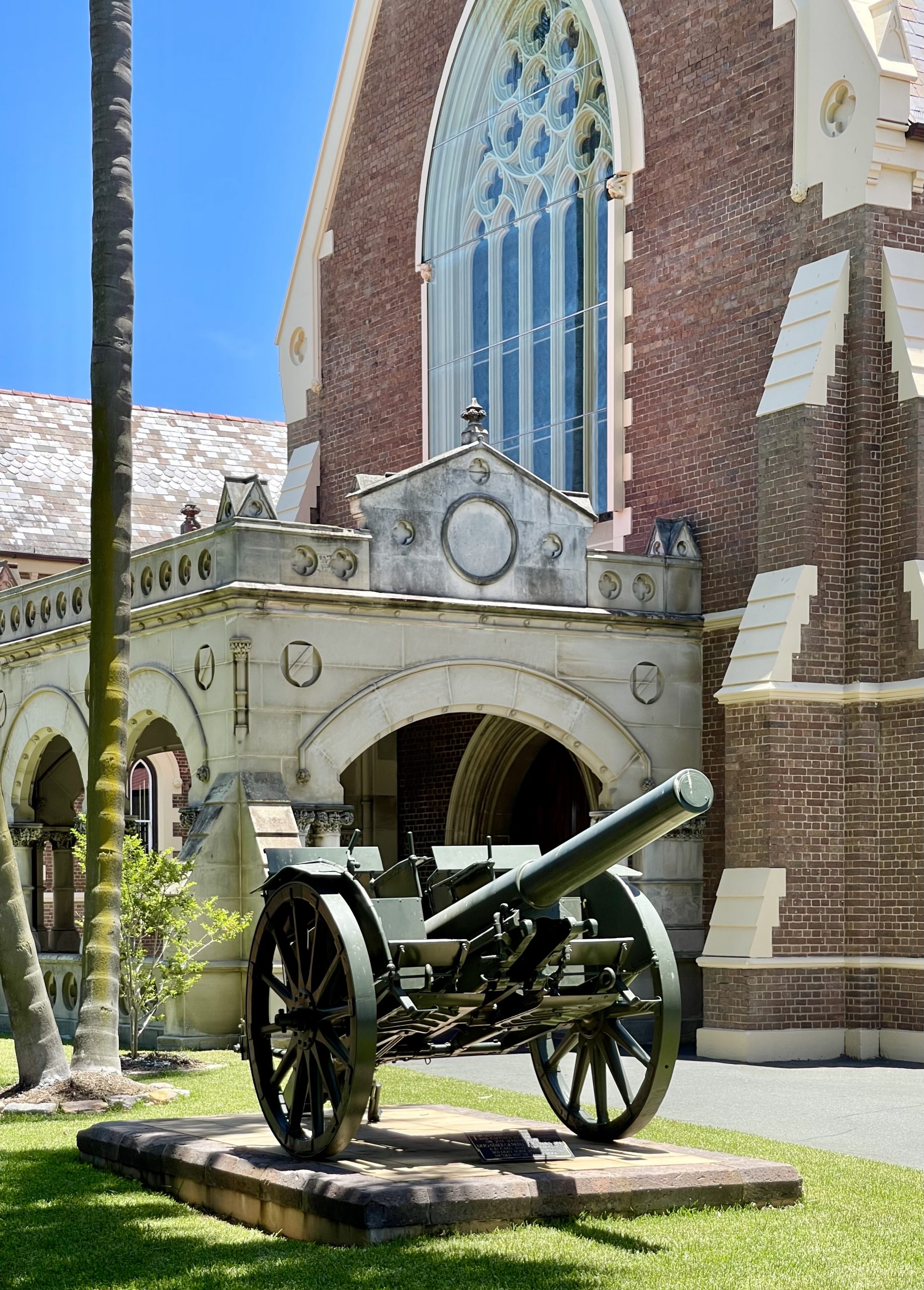 Photo of an ex-Ottoman M.15 barrel on its transport vehicle preserved at Brisbane school