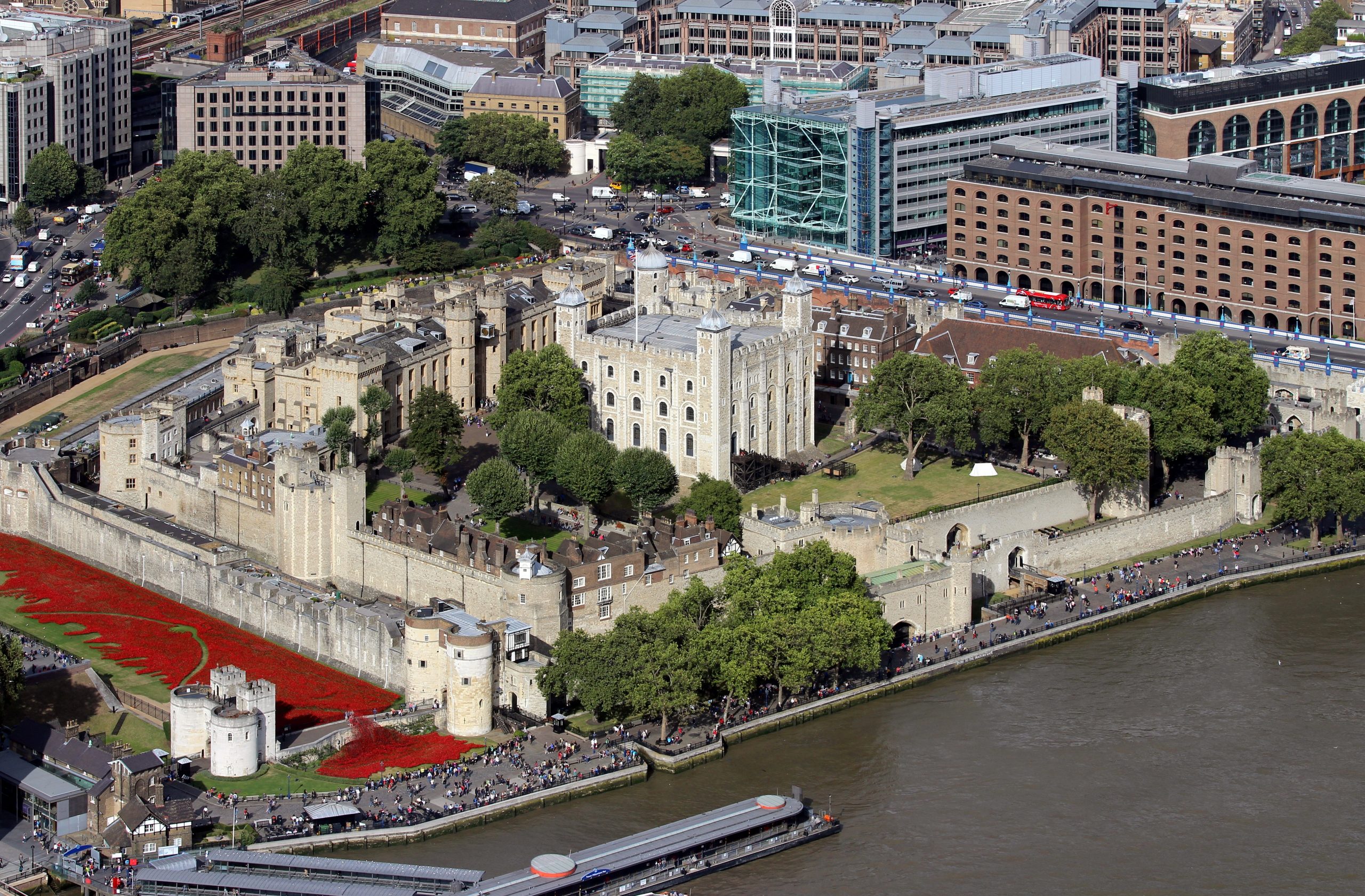 View of the Tower of London from The Shard, August 2014, UK. Blood Swept Lands and Seas of Red was a public installation created to commemorate the centenary of the outbreak of World War 1 and consisted of 888 246 ceramic red poppies, to represent one British or Colonial serviceman killed in the war.