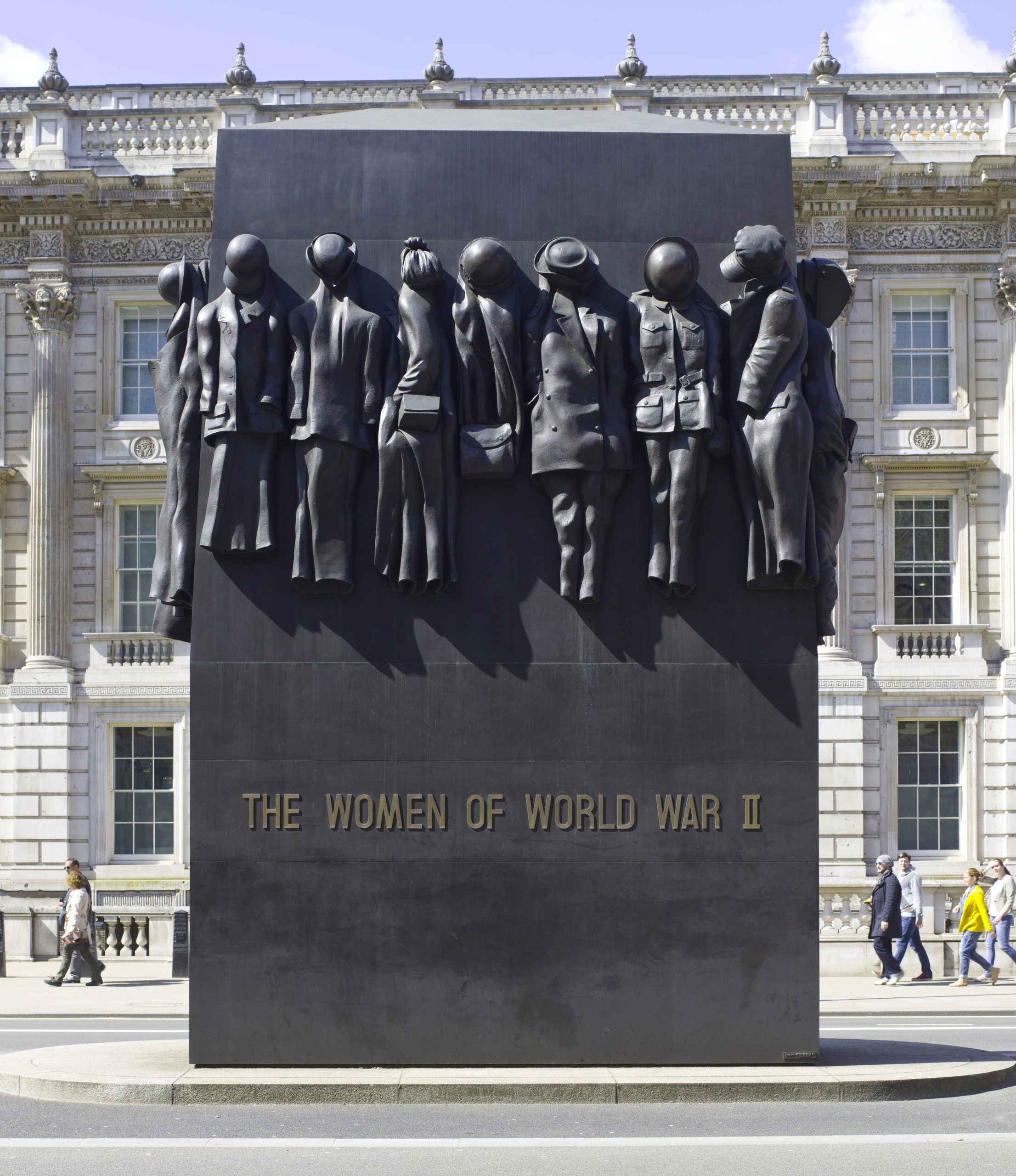 Monument to the Women of World War II is located on Whitehall in London. Sculpted by John W. Mills, the work is 22 feet (6.7 m) high, 16 feet (4.9 m) long, and 6 feet (1.8 m) wide. It is a row of statues of women's war clothing