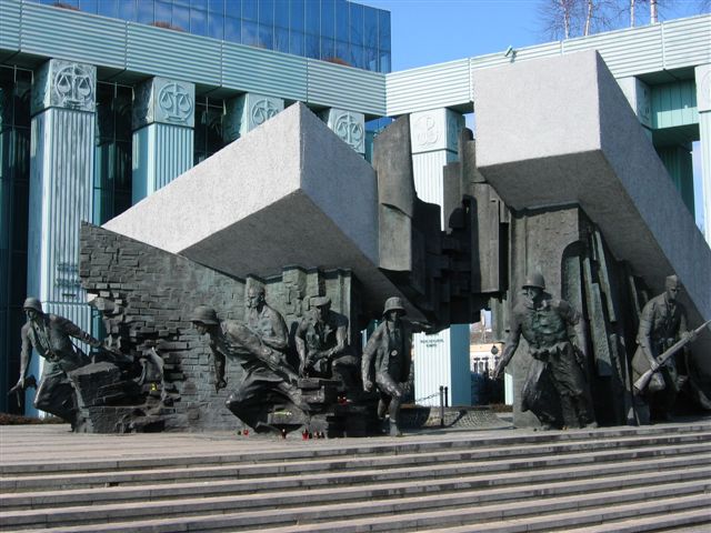 Statue of soldier coming out of a building