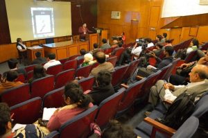 Photo of someone giving a speech in a lecture theatre