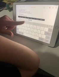 hand pointing on tablet screen