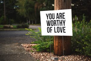 Sign on tree that says 'you are worthy'