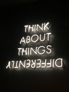 Sign that says 'Think about things differently'