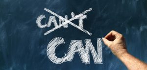 A decorative image of a blackboard with the word 'can't crossed out and the word 'can' written under it.